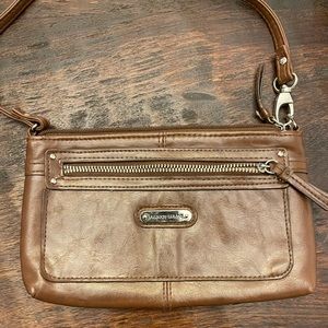 Brown leather clutch.